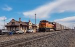 BNSF 6996 leads westbound Autoracks past the ex-ATSF depot in Hereford, TX